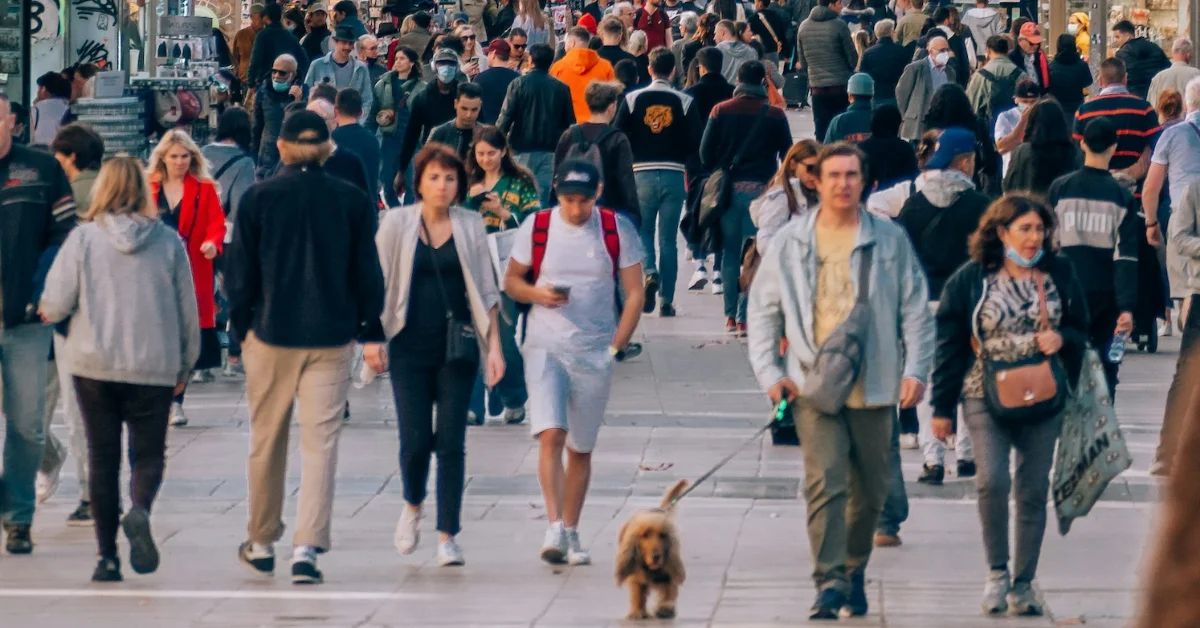 tourists walking along an overcrowded street in spain