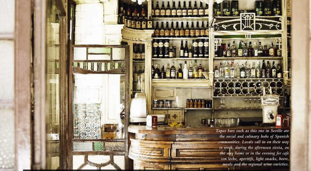 seville tapas bar showing multiple rows of wine bottles