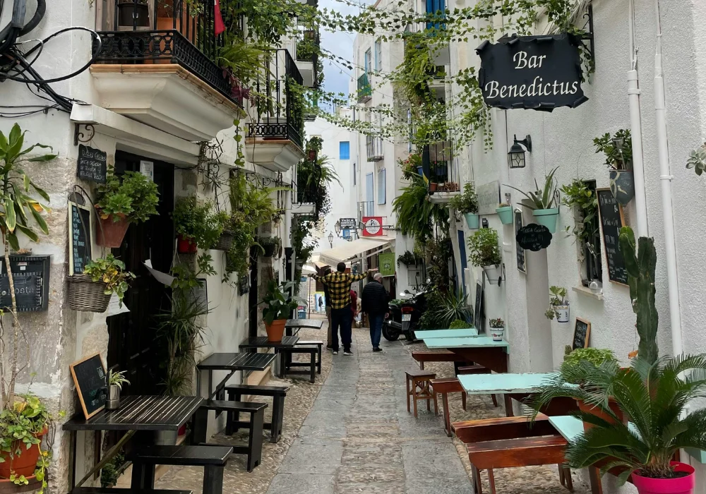 restaurants down a cobble stoned street in analucia spain
