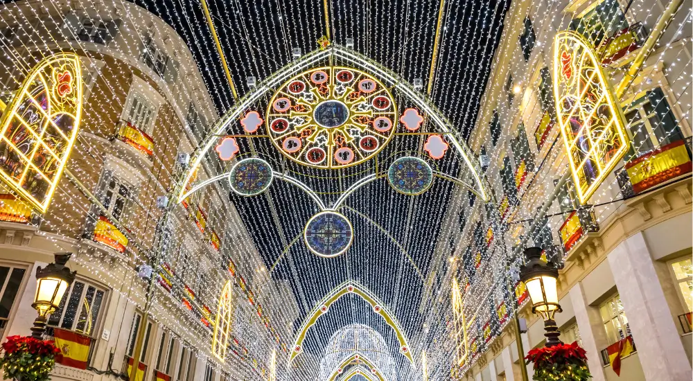 bright christmas decorations on a street in malaga spain