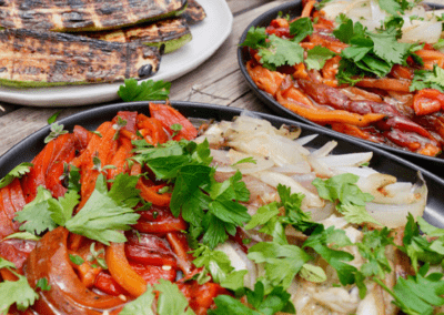 table laden with fresh seafood and local cooked vegetables