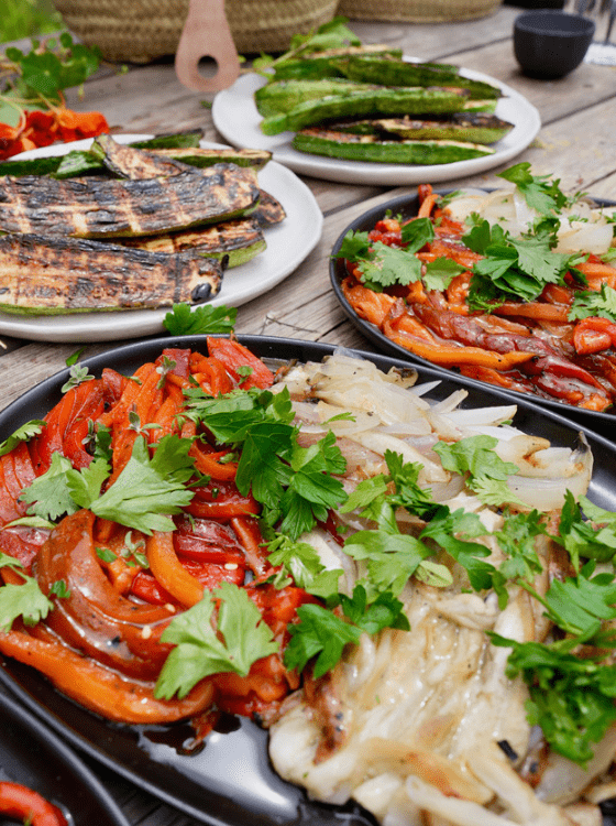 table laden with fresh seafood and local cooked vegetables