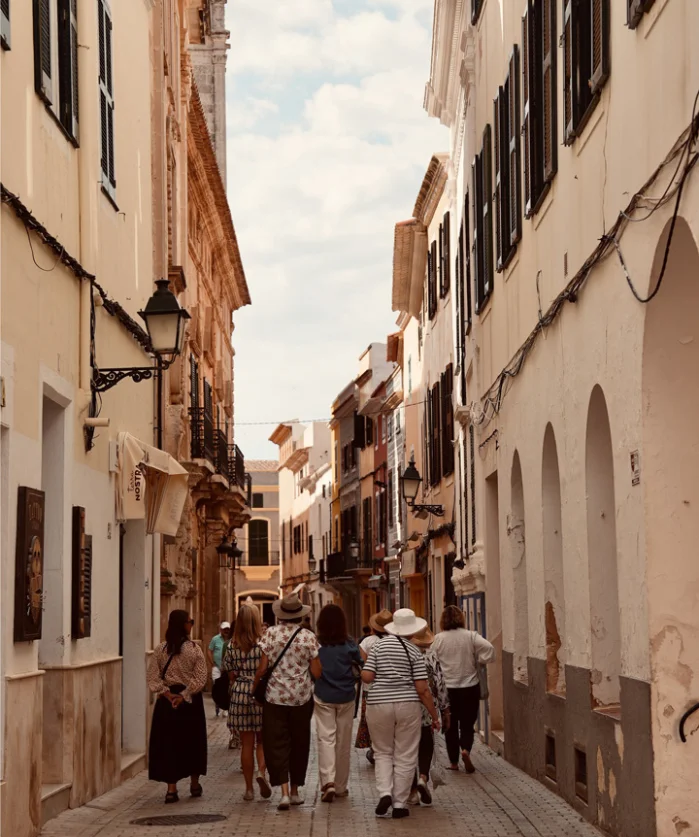 surrender to spain group tour walking down a cobbled stoned street